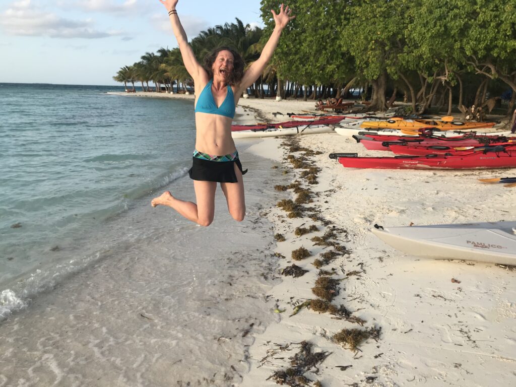 Spring jumping for joy on beach